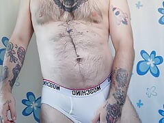 Bear takes off his white boxers and masturbates before taking a shower.