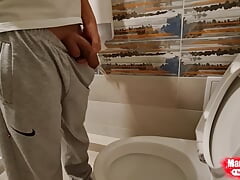 Young boy Mikel pissing at home