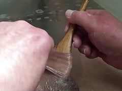 Bath-time foreskin with: wooden spoon
