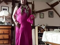 In a long fuchsia dress outfit for a night out