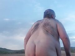 Fat guy naked in the mountains