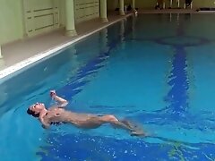 'Hungarian babe Sazan Cheharda swims and strips in the pool'