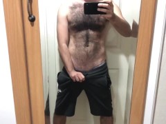 'hairy man magnify cock in front of the mirror'