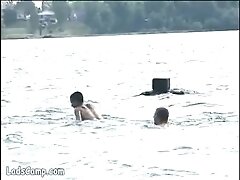 'Hot naked bathers banging on the shore of the lake'