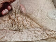 A nice hot bath playing with my ball sack and letting the piss flow all over my hairy body